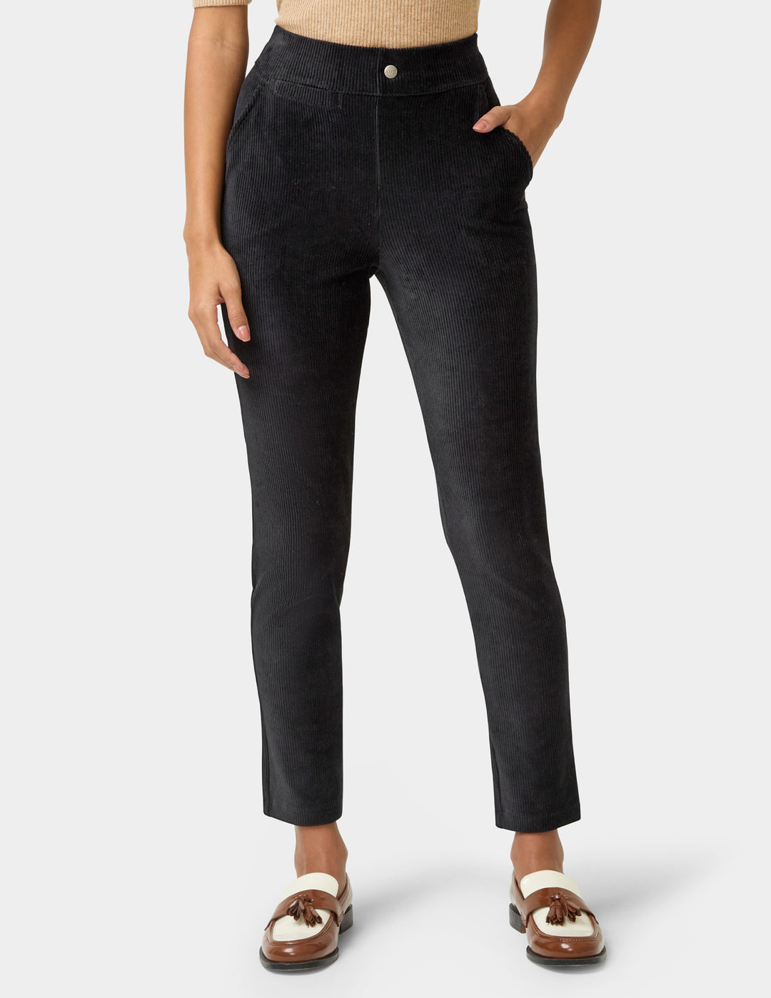 Black pants worn by a person on a white background