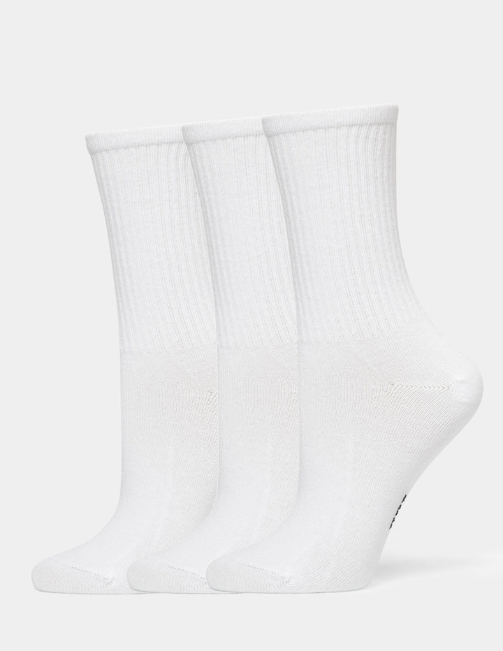 Three pairs of white crew socks arranged side by side on a light gray background.