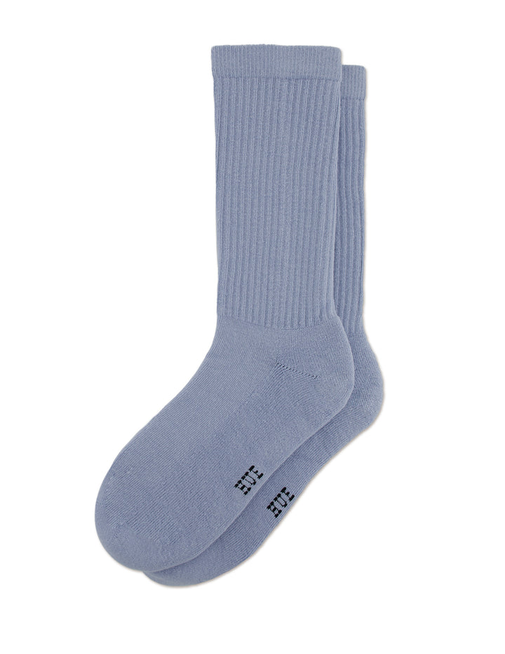 Pair of HUE men's light blue socks on a white background