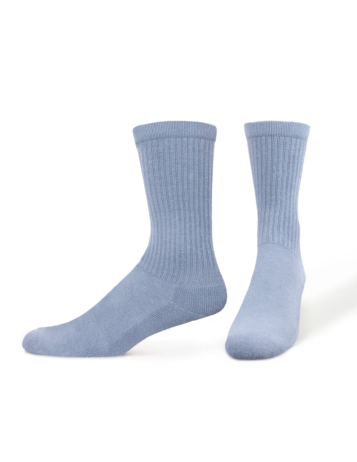 Pair of HUE men's light blue socks on foot forms on a white background