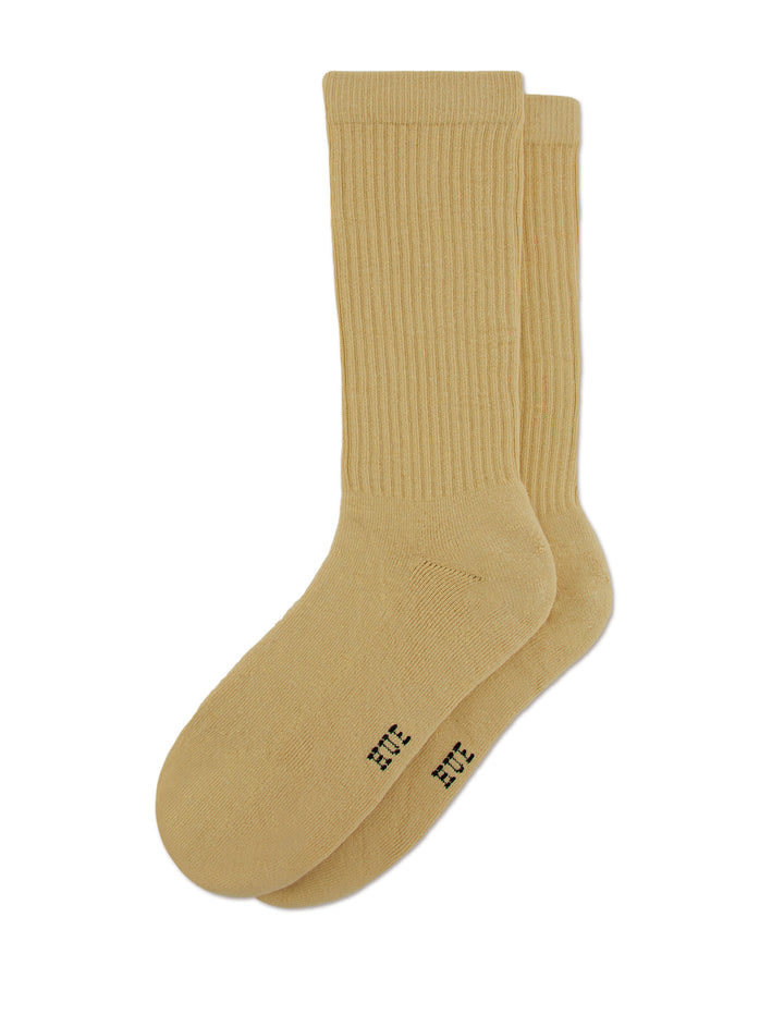 Pair of mustard yellow men's socks on a white background