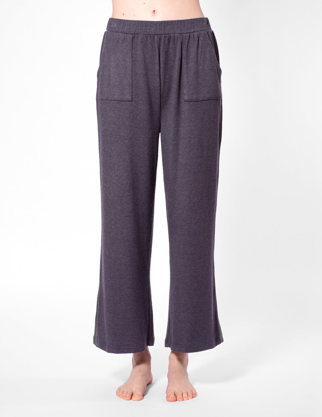 Dark grey wide-leg pants worn by a person on a white background