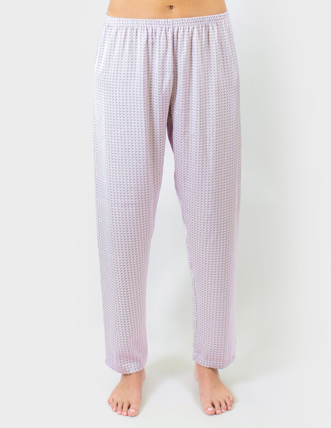 Woven pants worn by a person on a white background