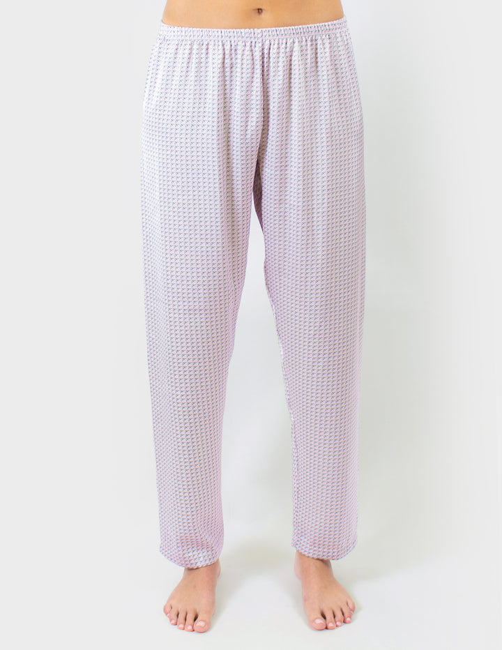 Woven pants worn by a person on a white background