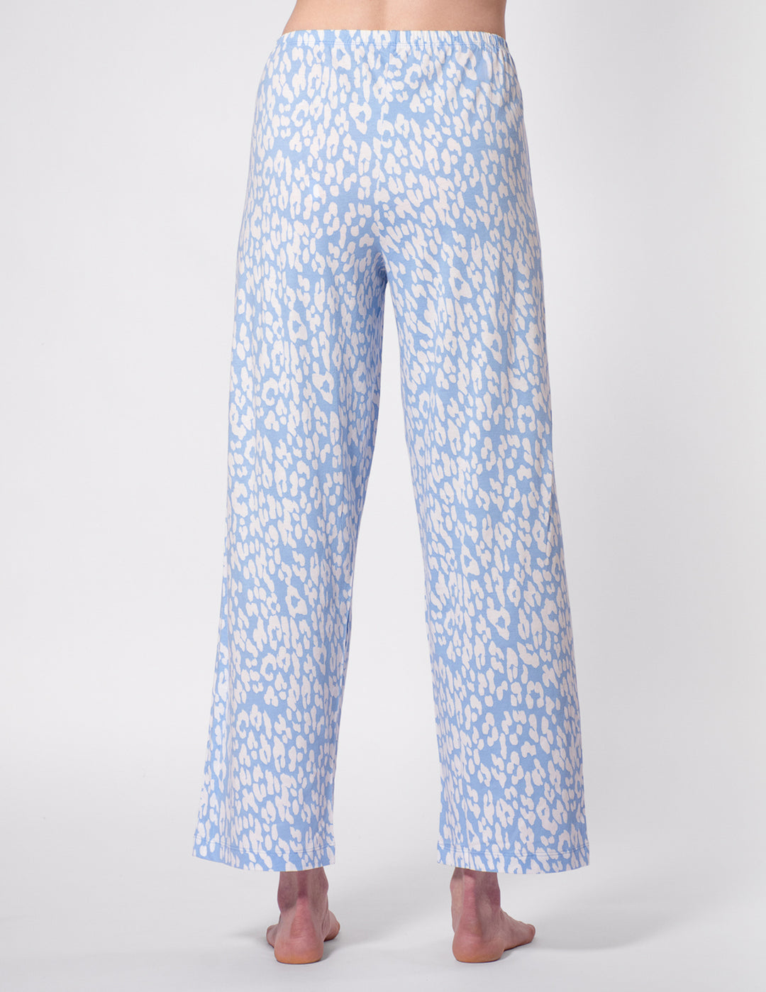 Light blue floral patterned pants on a white background