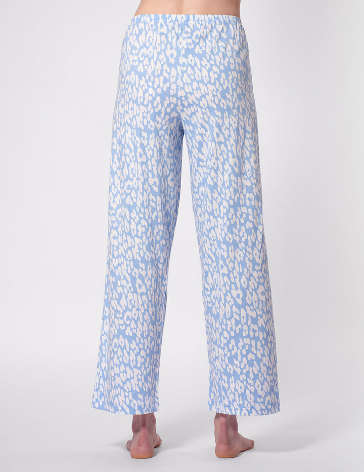 Light blue floral patterned pants on a white background