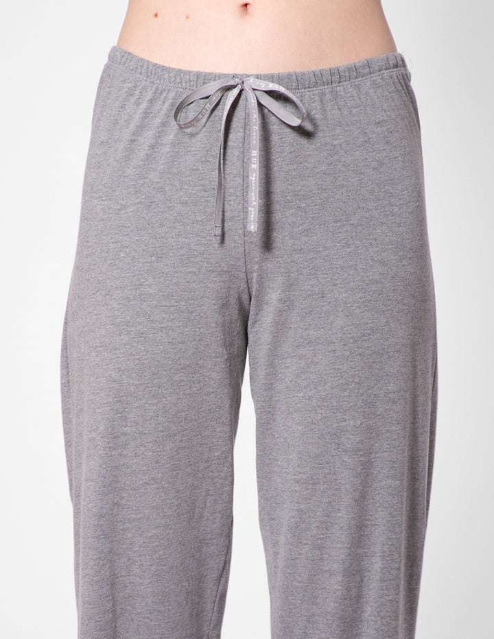 Gray pajama pants with a drawstring on a white background