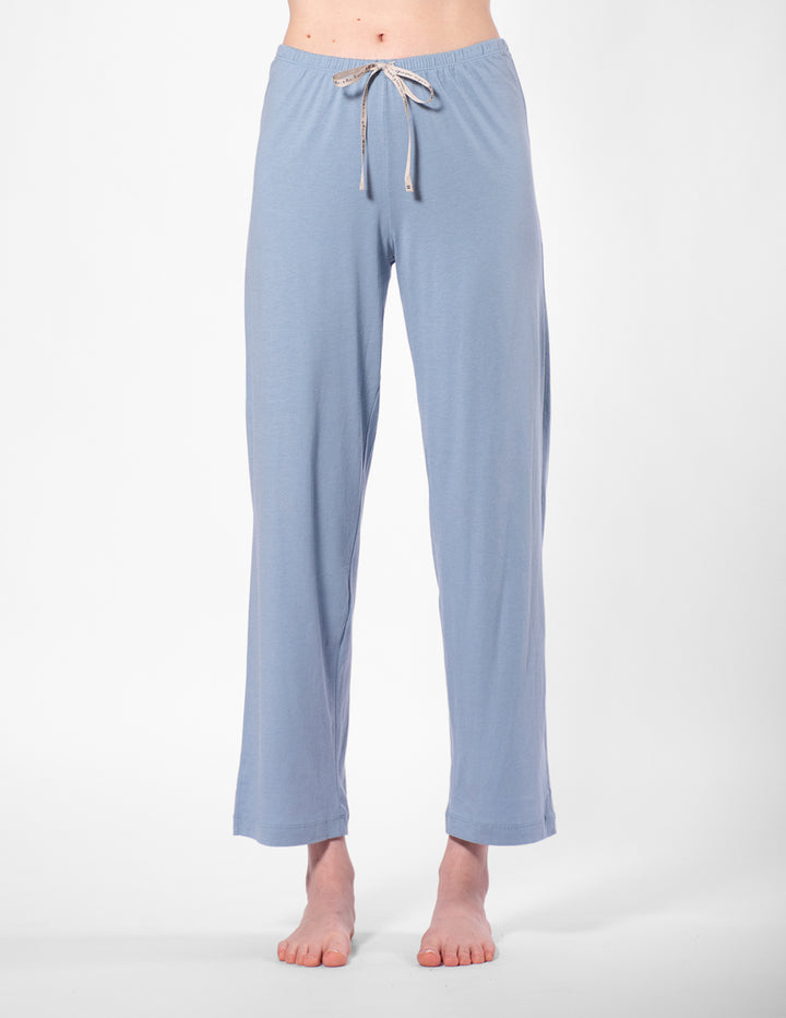 Light blue pajama pants with a drawstring on a white background