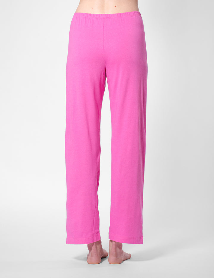 Pink pants worn by a person on a white background