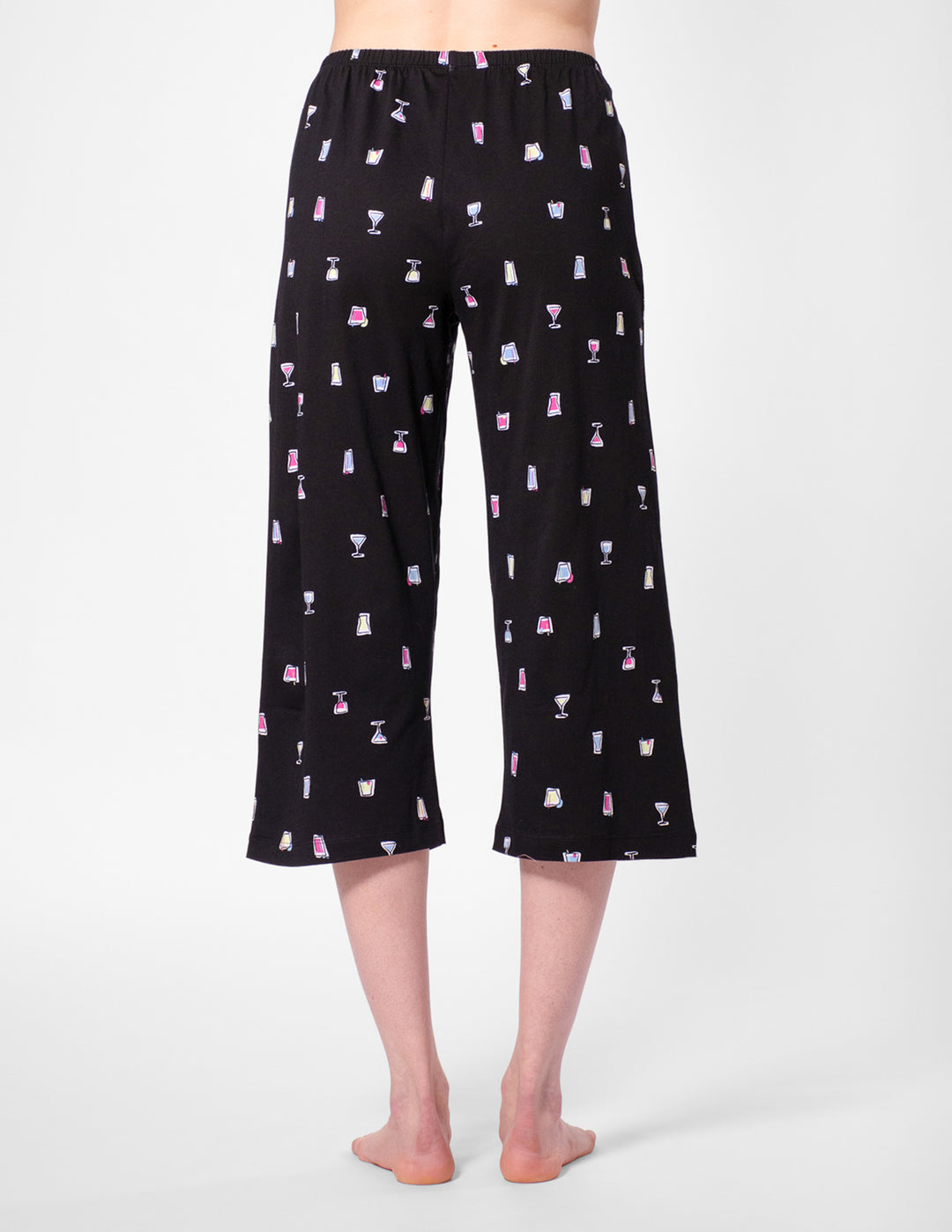 Black capri pajama pants with a pattern on a white background