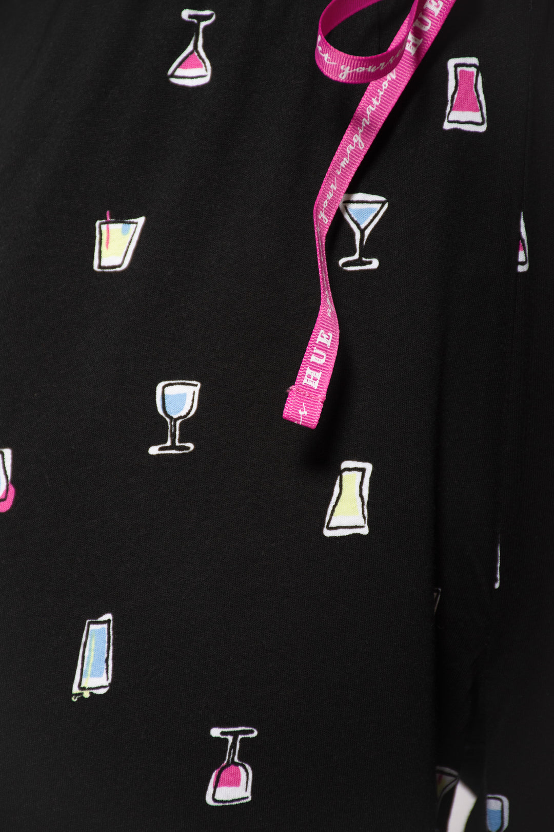 Black fabric with colorful drink icons and a pink drawstring on a black background