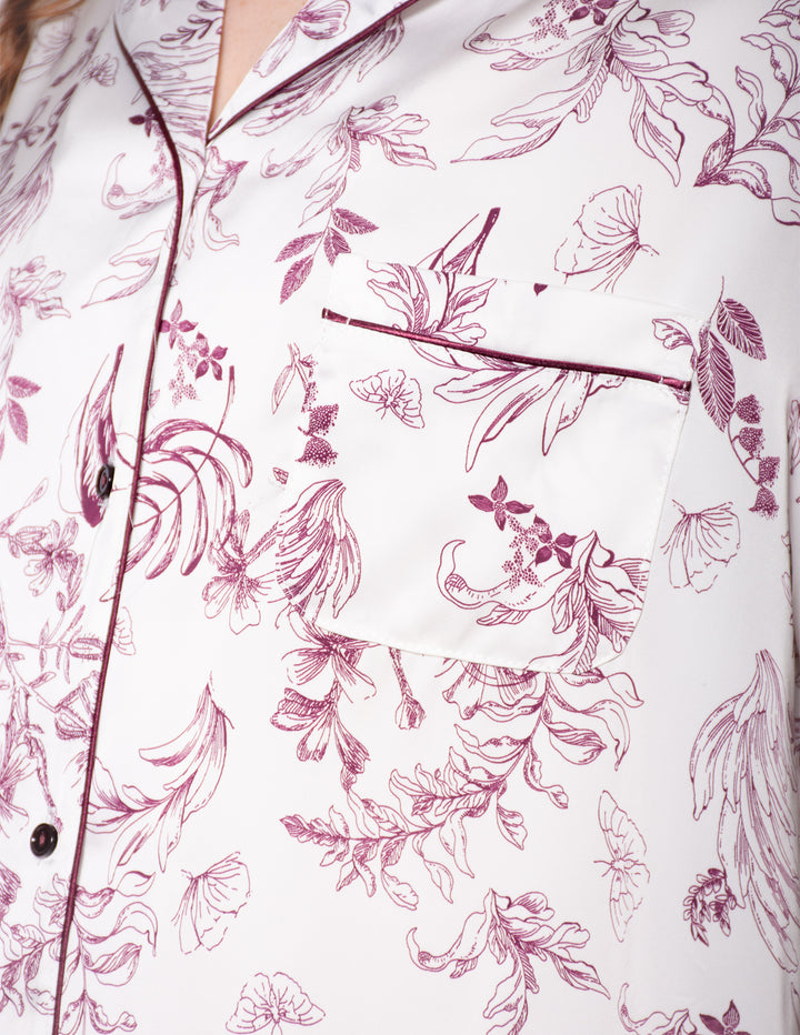Floral patterned shirt with pink and purple flowers on a white background