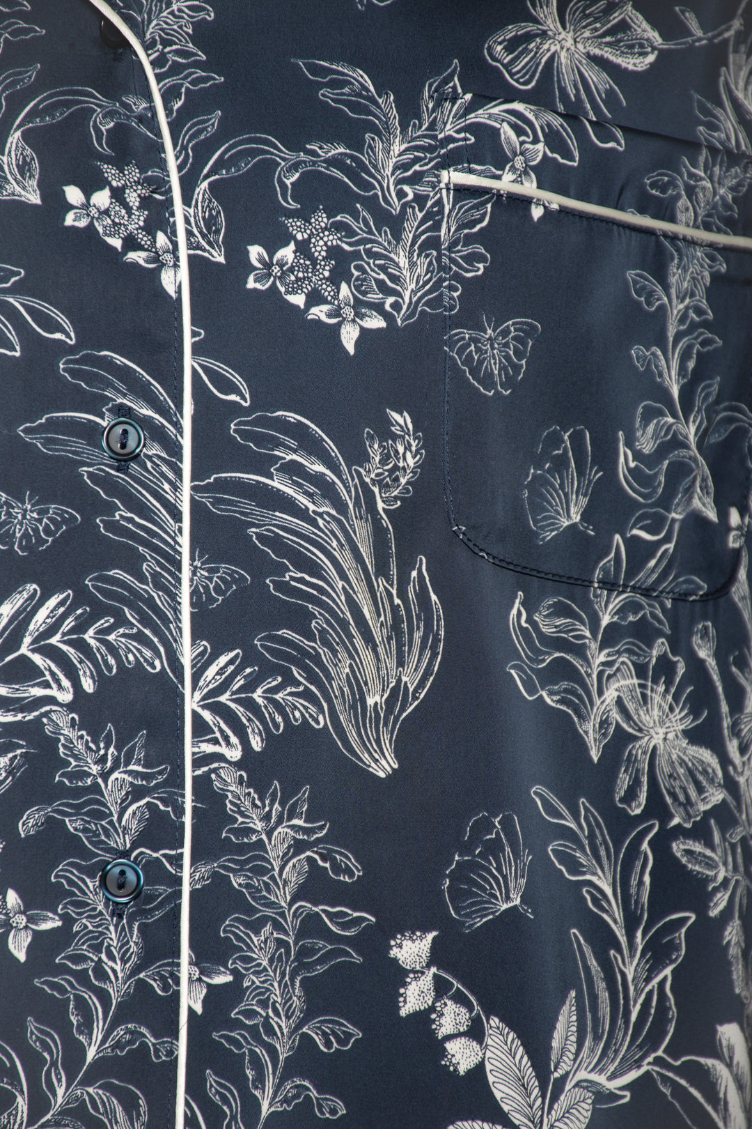 Close-up of a navy shirt with white floral pattern