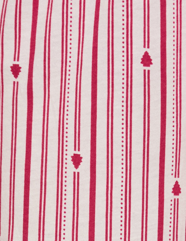 Detailed view of a white fabric with pink accent stripes and small tree designs.