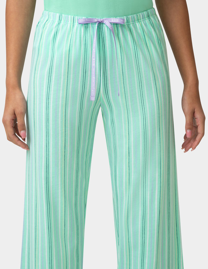 Green striped pants with a tie waist on a white background
