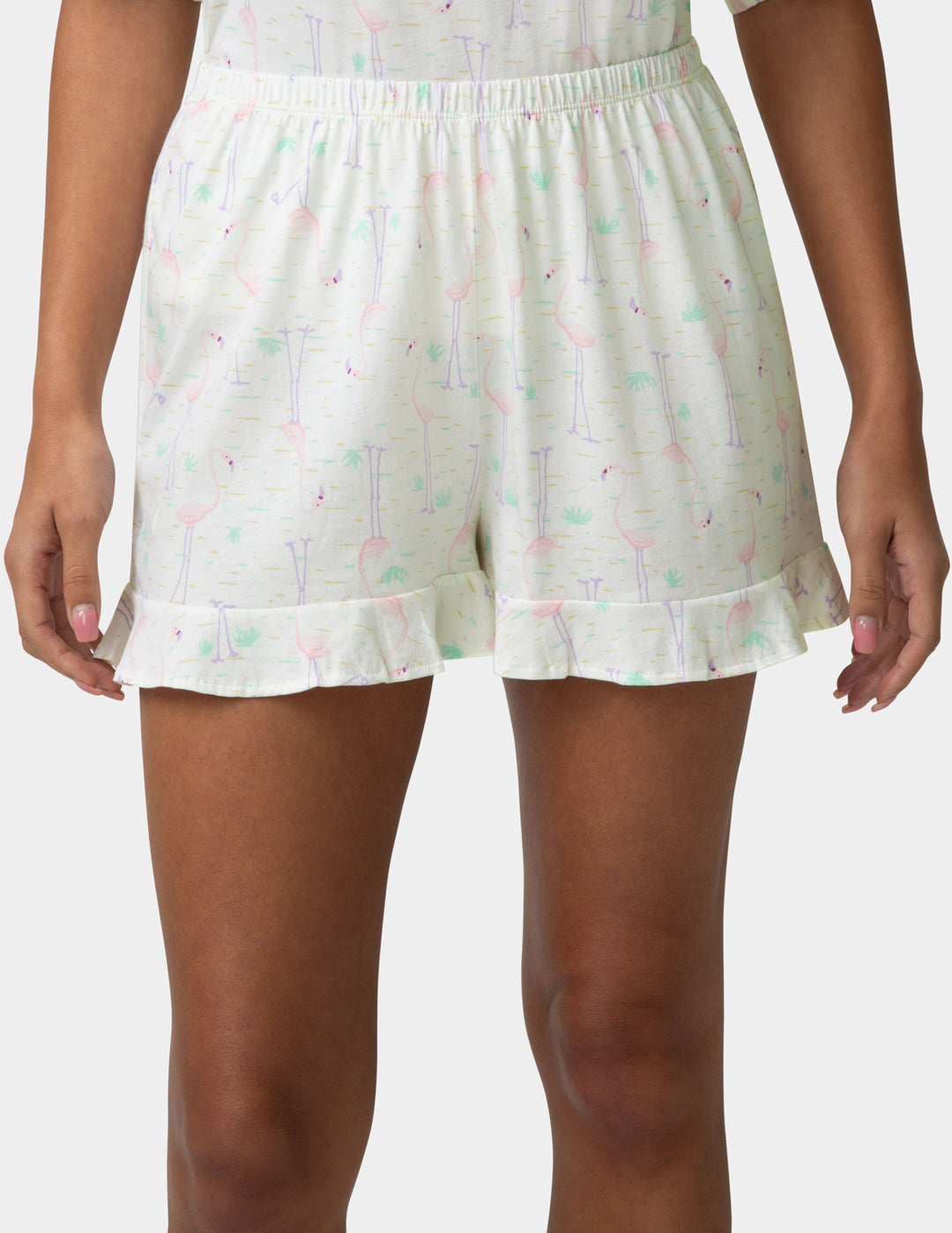 White shorts with colorful patterns on a plain background