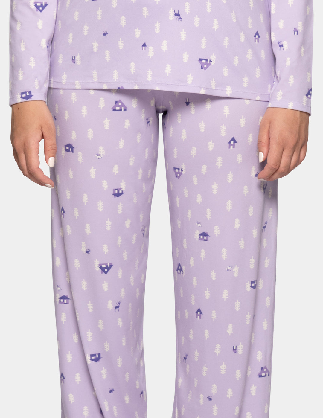 A model wearing long pajama pants in a light lavender color with a repeating pattern against a light gray background.