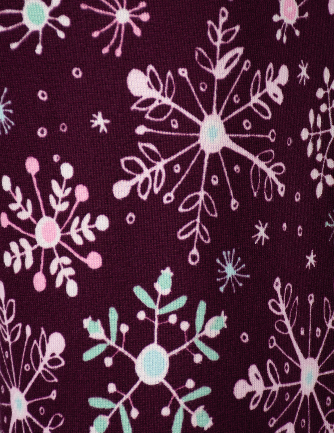 A close-up of a purple background fabric with a snowflake design.