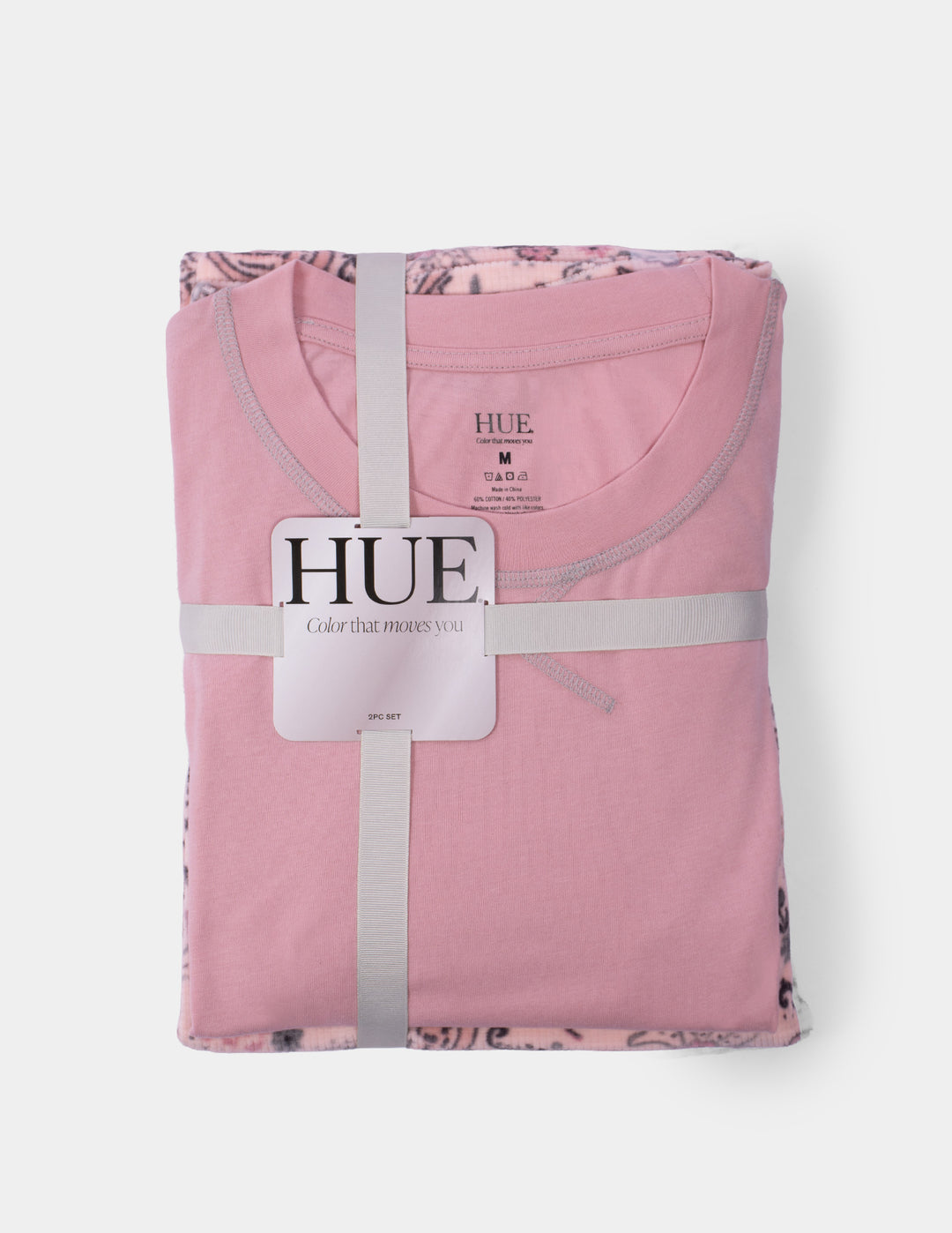A pink pajama set displayed against a light grey background.