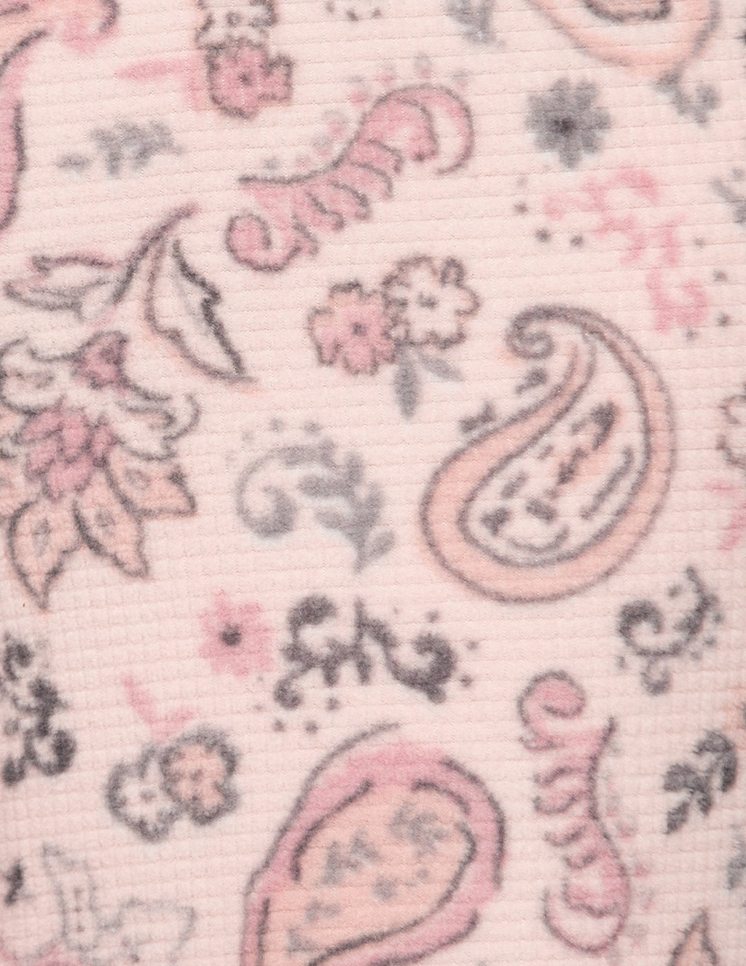 Closeup of a pink paisley pattern.
