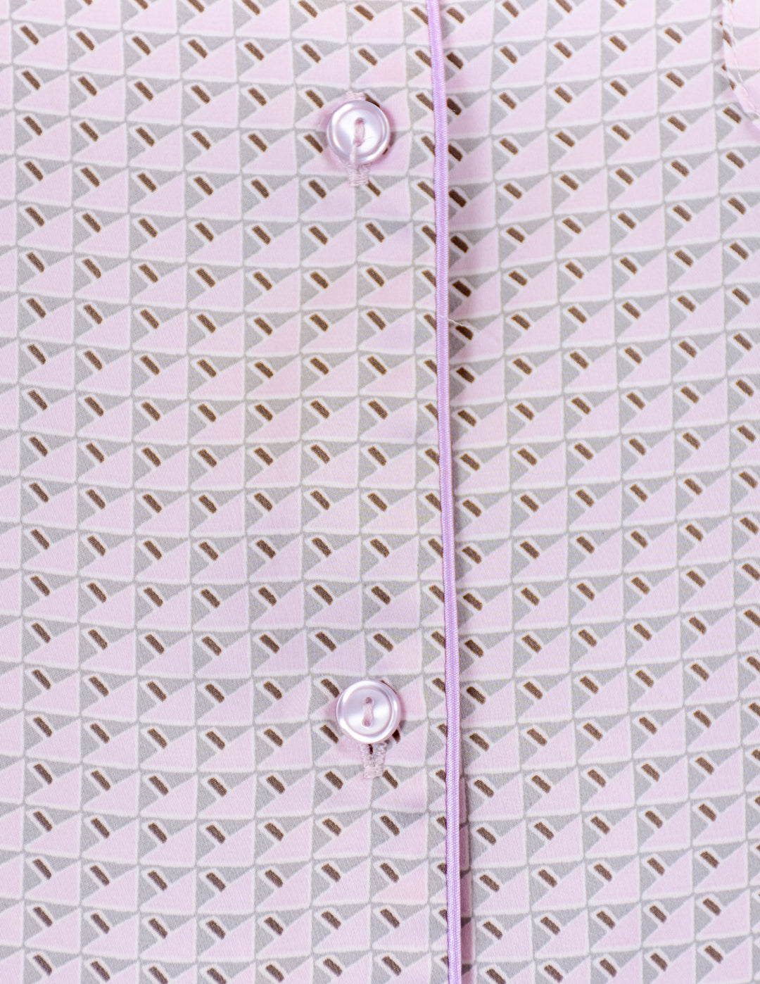 Close-up of a pink textured fabric with button details