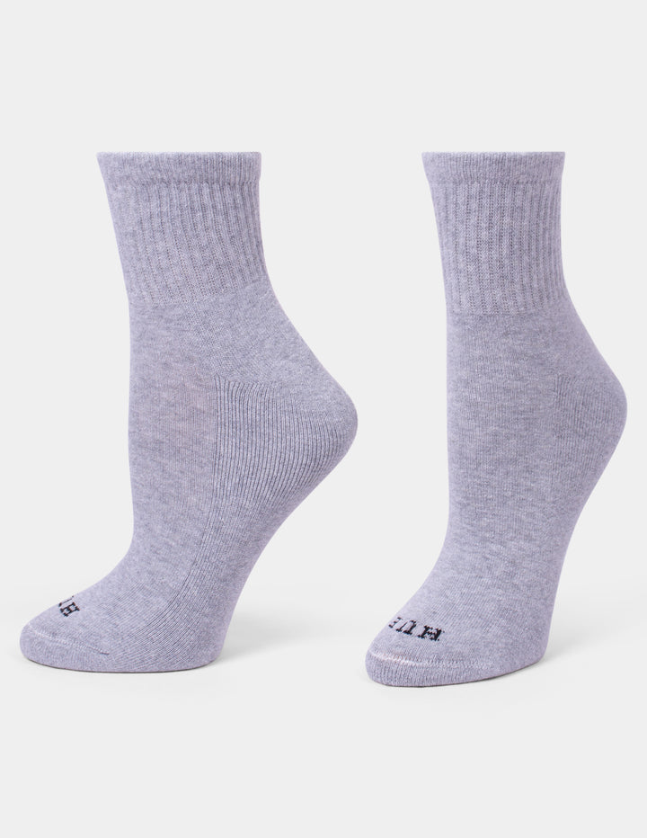 A pair of heather grey mini crew socks shown on a light gray background.