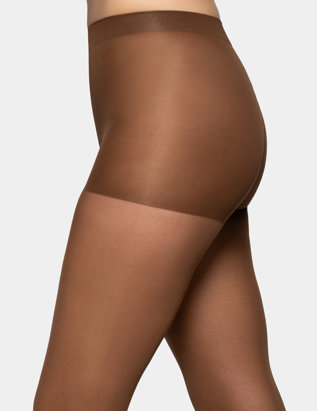 Close-up side view of a model wearing sheer brown hosiery with a wide waistband and a lighter sheer band near the upper thigh, against a light gray background.