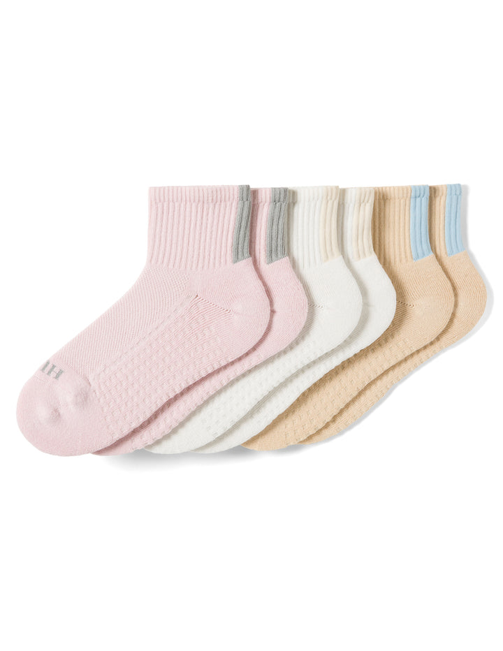 Set of pastel-colored socks on a white background
