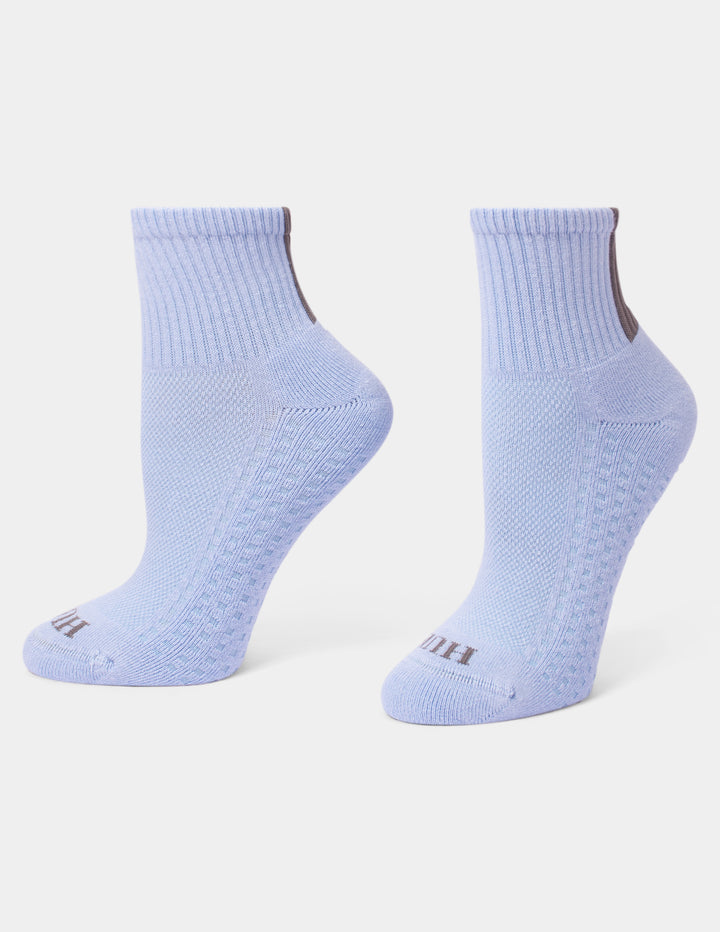A pair of light blue mini crew socks shown from the side on a clean white background.