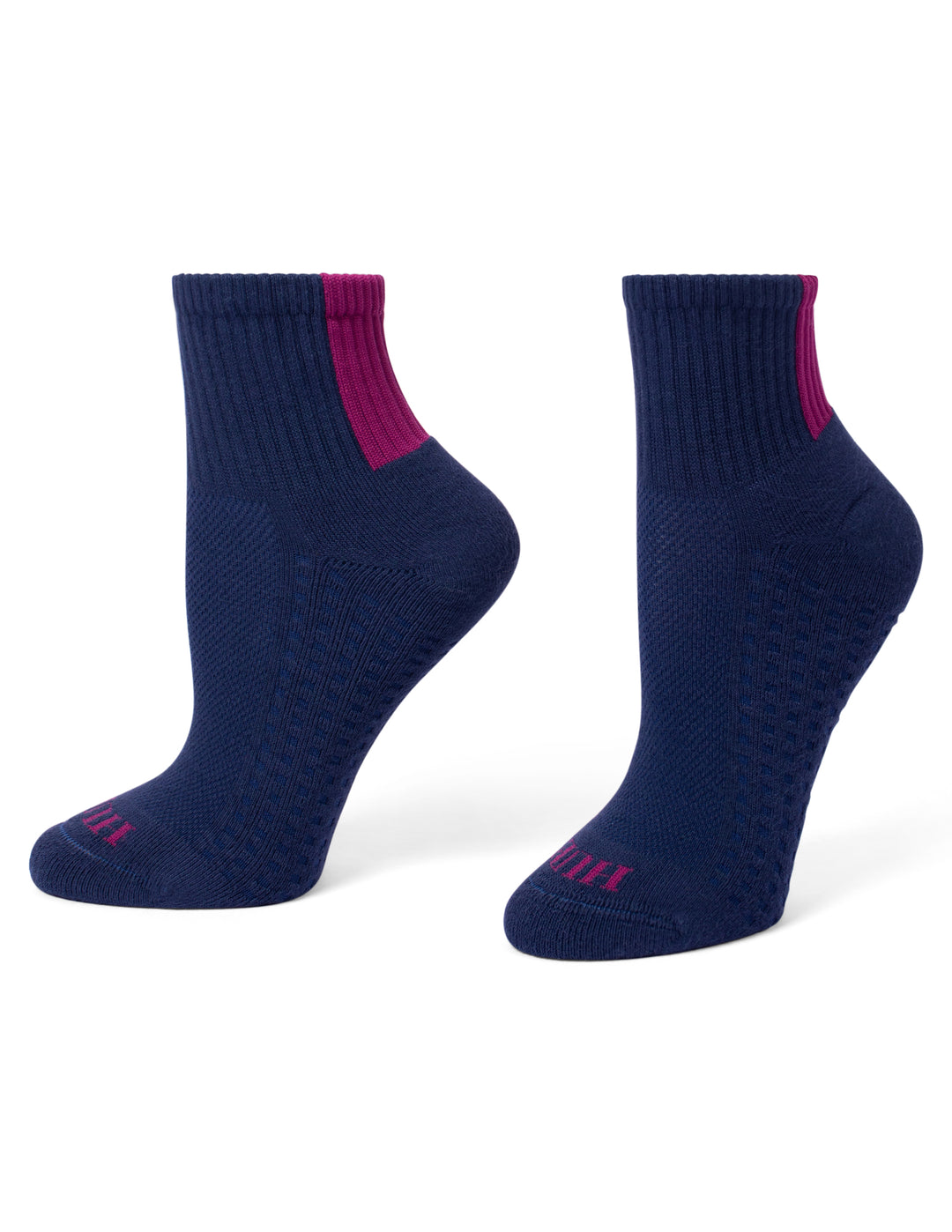 A pair of navy blue mini crew socks with a magenta pink accent stripe near the ribbed ankle cuff and matching pink branding on the toes, shown against a plain white background.