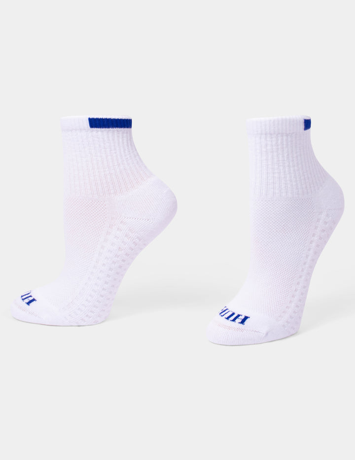A pair of white mini crew athletic socks with blue accents displayed against a light gray background.