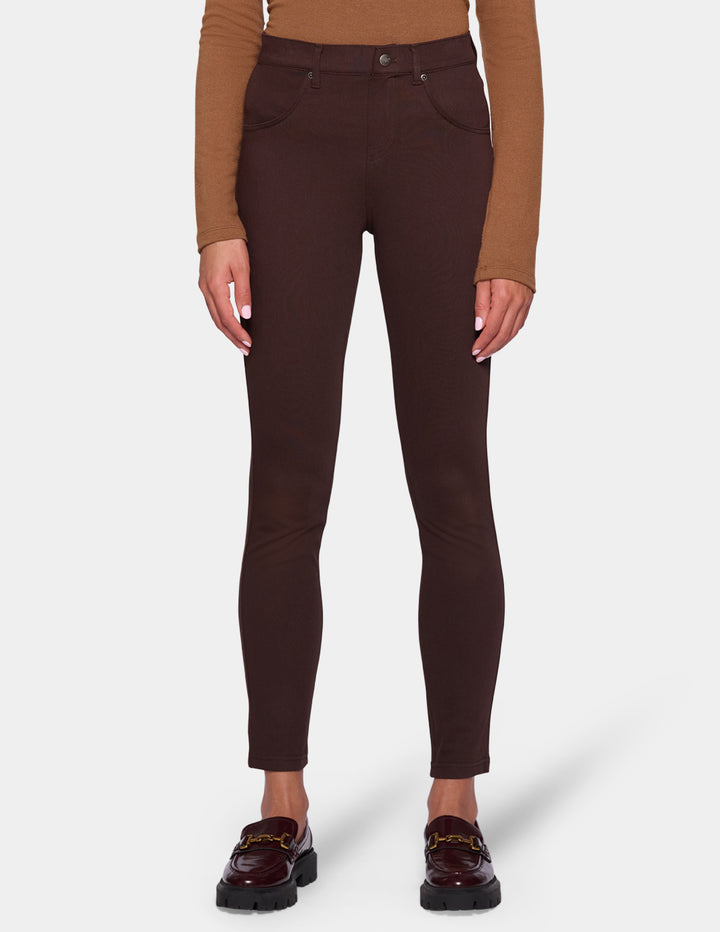 A model wearing dark brown leggings