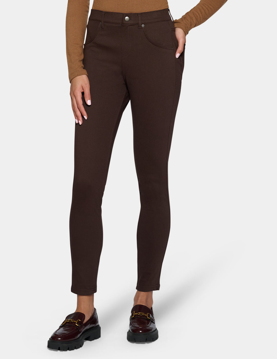 A model wearing dark brown leggings