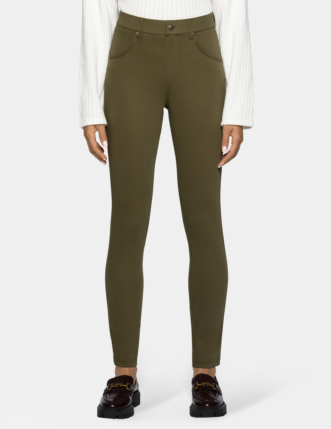 A model wearing olive green leggings