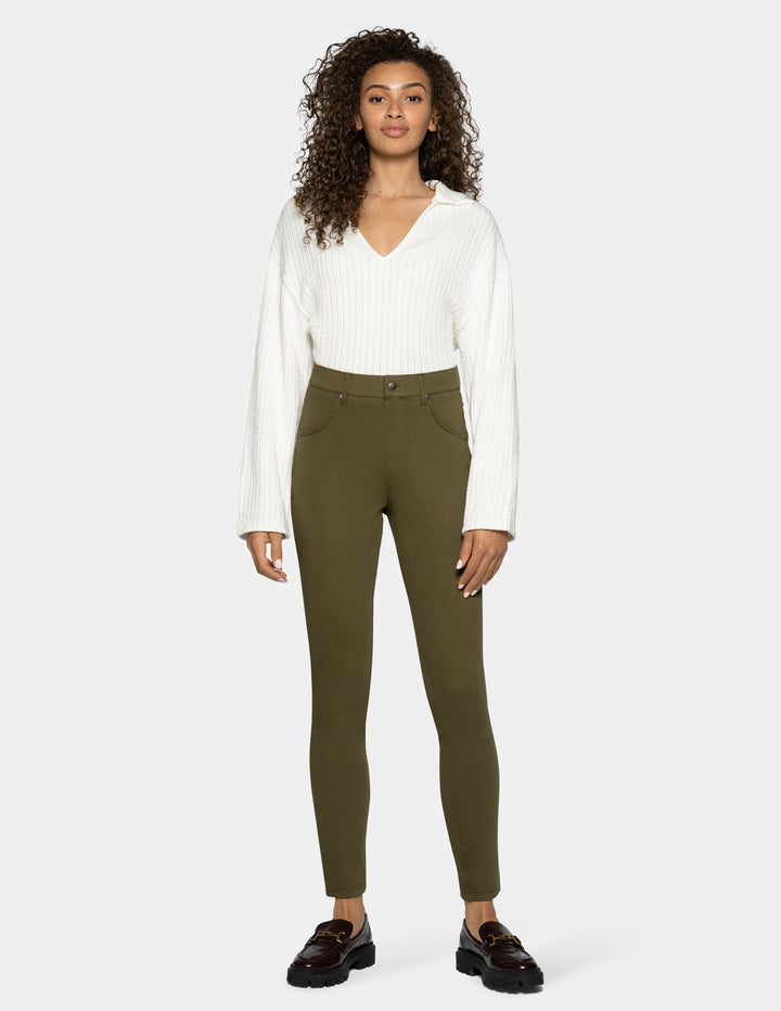 A woman modeling olive green leggings