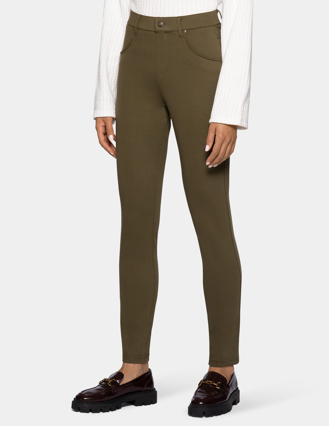 A model wearing olive green leggings