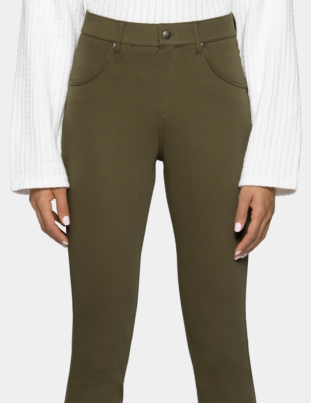A person wearing olive green leggings