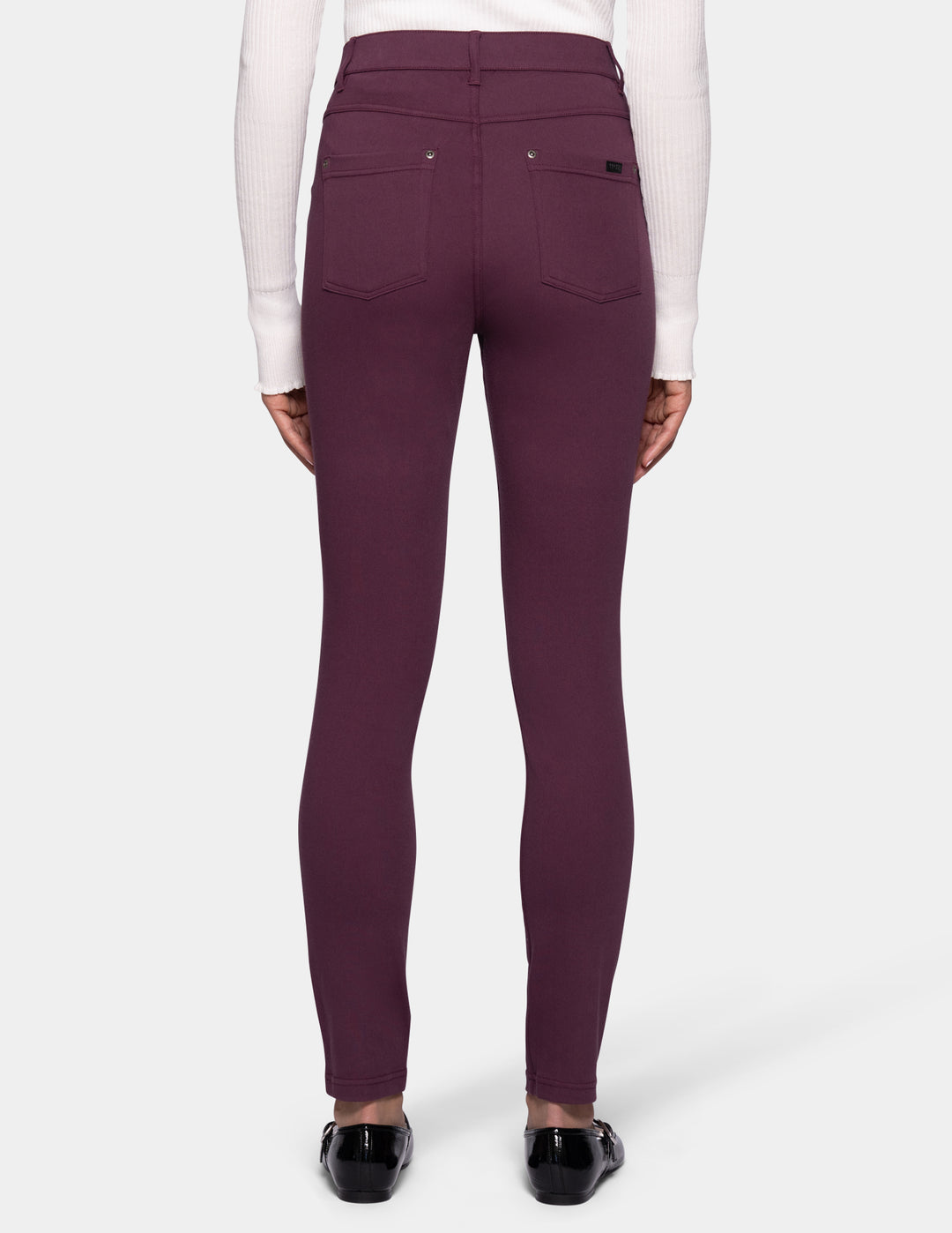 Rear view of a model wearing high-waisted leggings