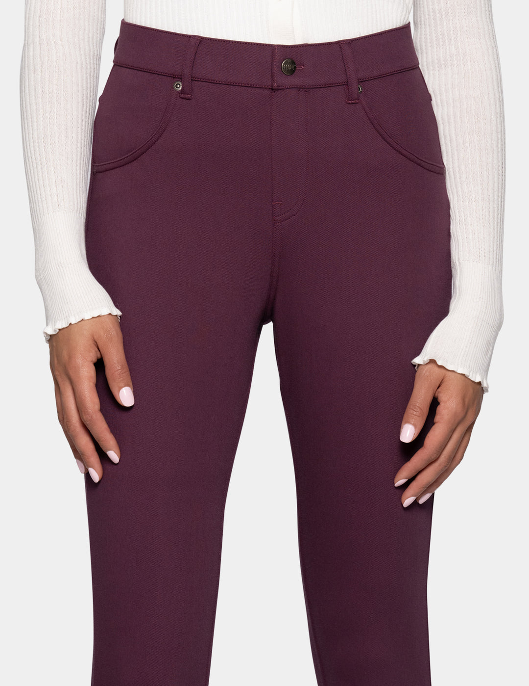 A close-up of a person wearing high-waisted leggings