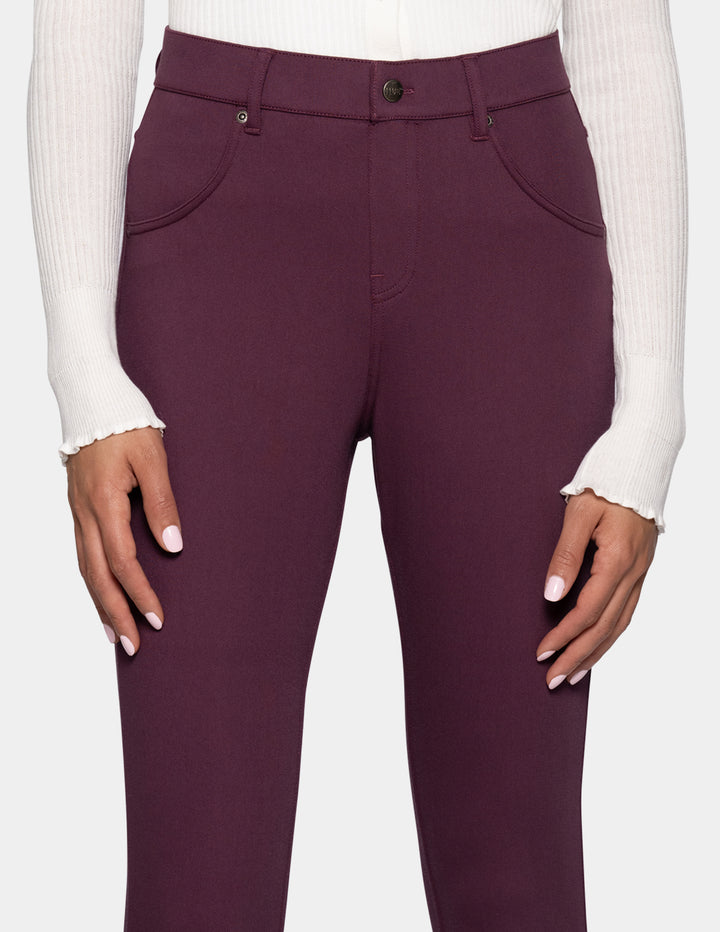 A close-up of a person wearing high-waisted leggings