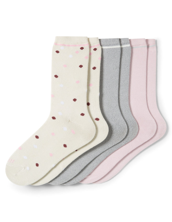 Set of three pairs of socks with different patterns on a white background