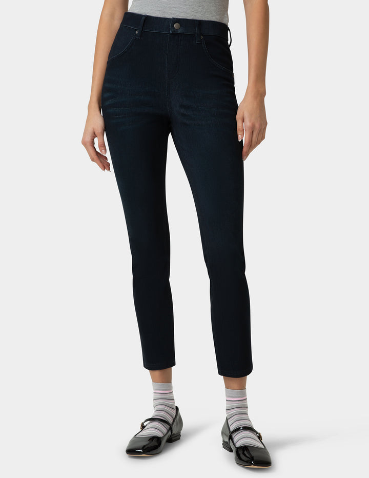 Person wearing black pants on a white background