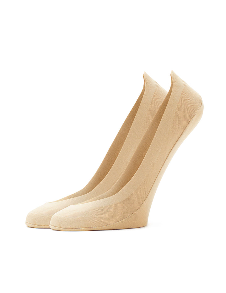 One pair of beige liner socks on a white background