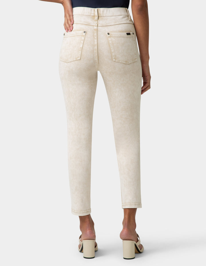 Beige jeans worn by a person on a white background