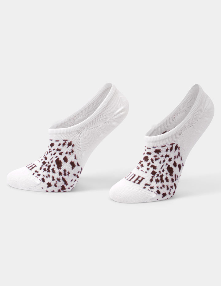 A pair of white liner socks with a brown leopard print pattern on the foot, shown against a light gray background.