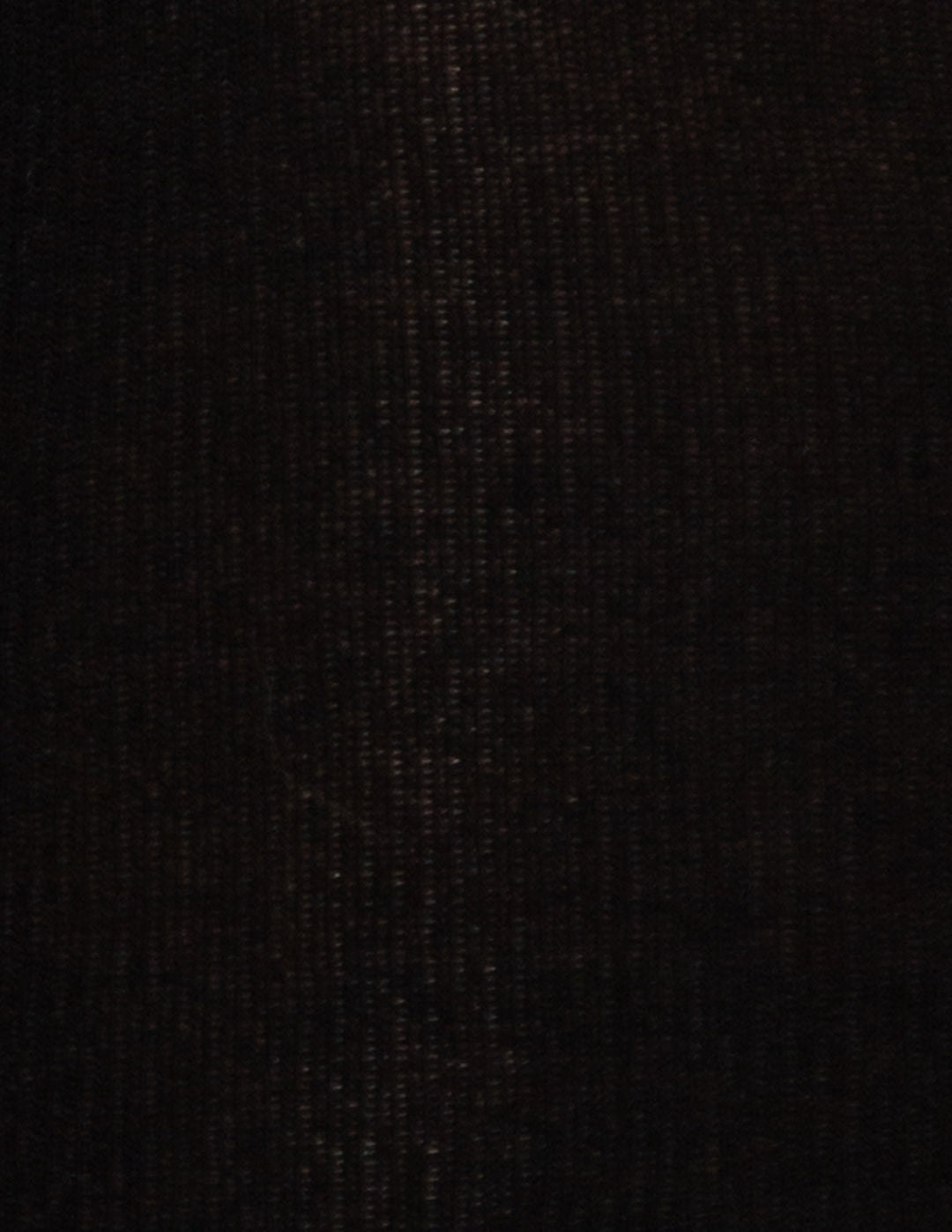 A close-up texture shot of a very dark, black woven fabric with subtle vertical ribbing.