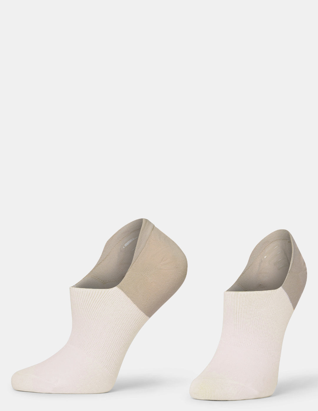 A pair of low-cut ankle socks in a two-tone colorway of off-white and light taupe, shown against a plain light gray background.