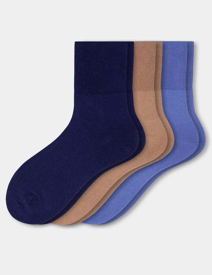 Three pairs of crew socks in navy blue, tan, and periwinkle blue, arranged in a fan shape against a light gray background.