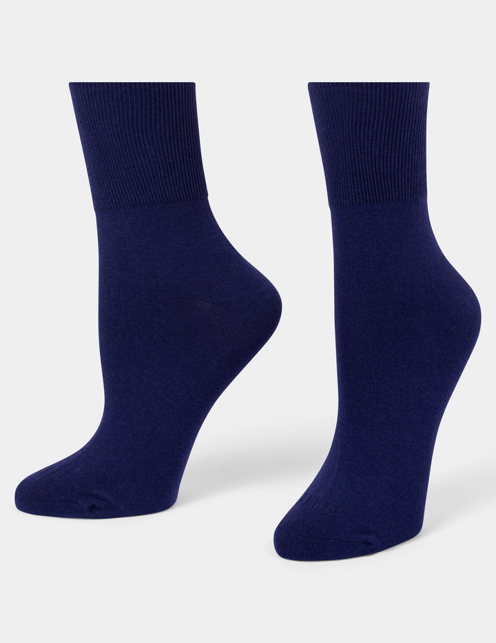 A pair of navy blue crew socks displayed on foot forms against a light gray background.