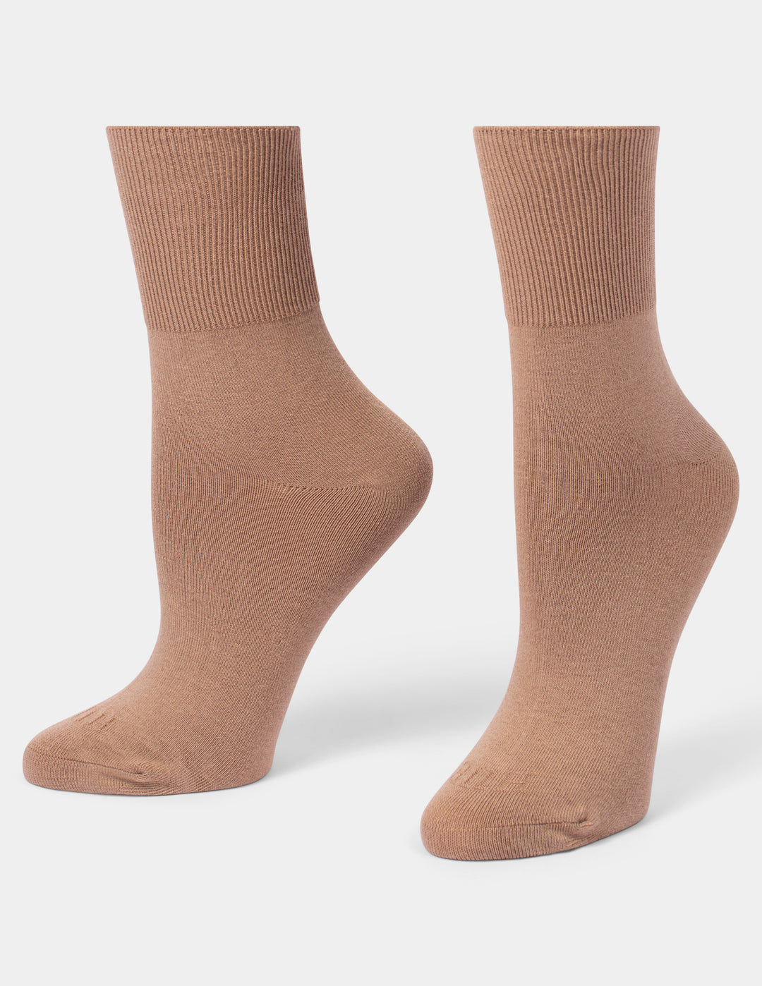 A pair of ribbed crew socks in a warm tan-brown color, displayed on foot forms against a light gray background.
